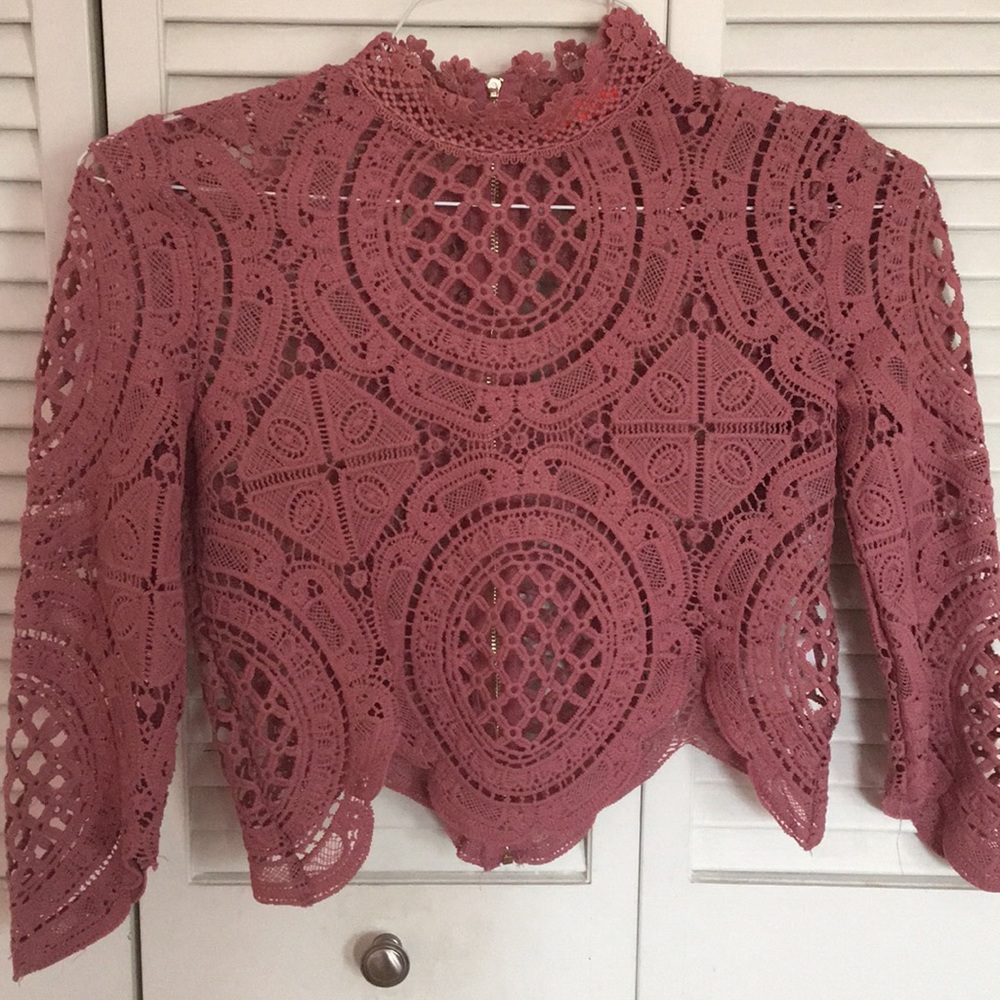 Vibrant pink shirt with cut out detailing